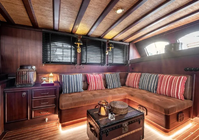  Yacht Photos Pics Luxurious interior of 1993 Custom Sailing Yacht Ocean Pure with cozy seating and nautical decor.