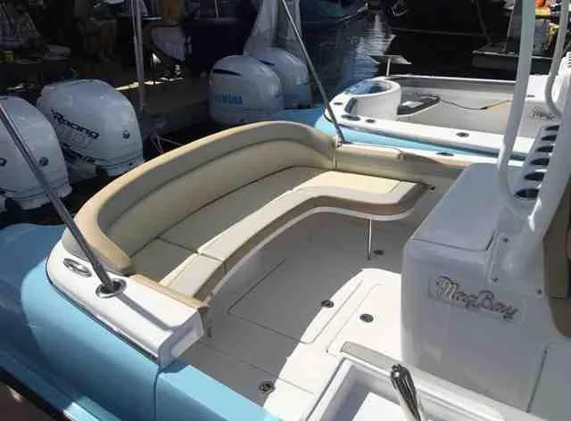  Yacht Photos Pics 2025 Mag Bay 33 boat with beige seating and twin outboard engines.