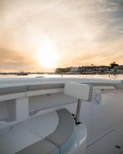  Yacht Photos Pics 2025 Mag Bay 33 boat at sunset on the water.