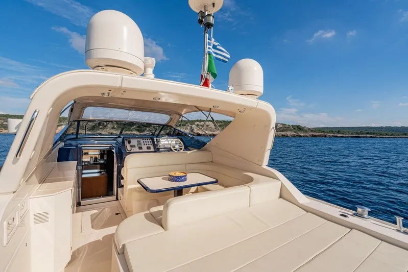  Yacht Photos Pics Luxurious 1996 Riva BAHAMAS 60 SPECIAL yacht with elegant seating and ocean view.