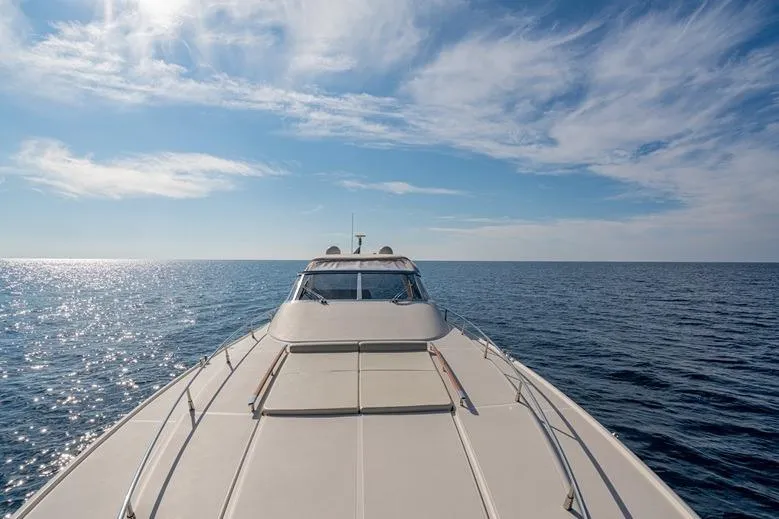  Yacht Photos Pics Riva BAHAMAS 60 SPECIAL yacht cruising on open sea under clear blue sky.