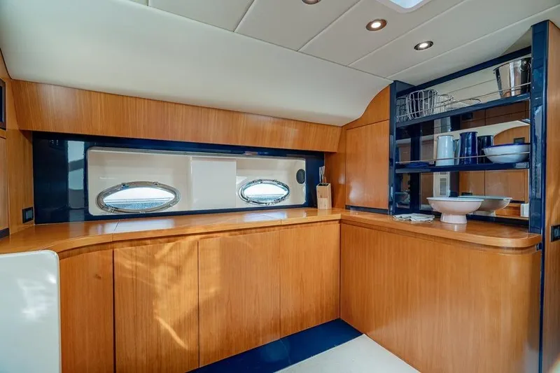  Yacht Photos Pics Luxurious wooden interior of 1996 Riva BAHAMAS 60 SPECIAL yacht kitchen.