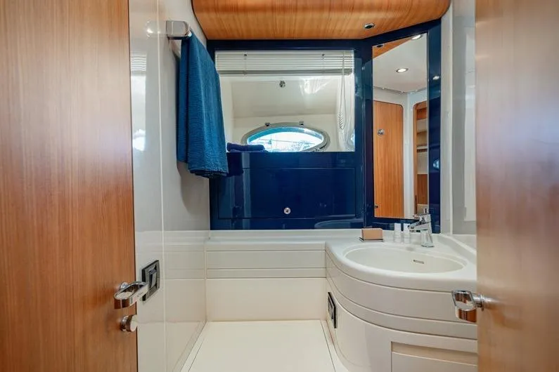  Yacht Photos Pics Luxurious bathroom interior of 1996 Riva BAHAMAS 60 SPECIAL yacht, featuring modern fixtures.