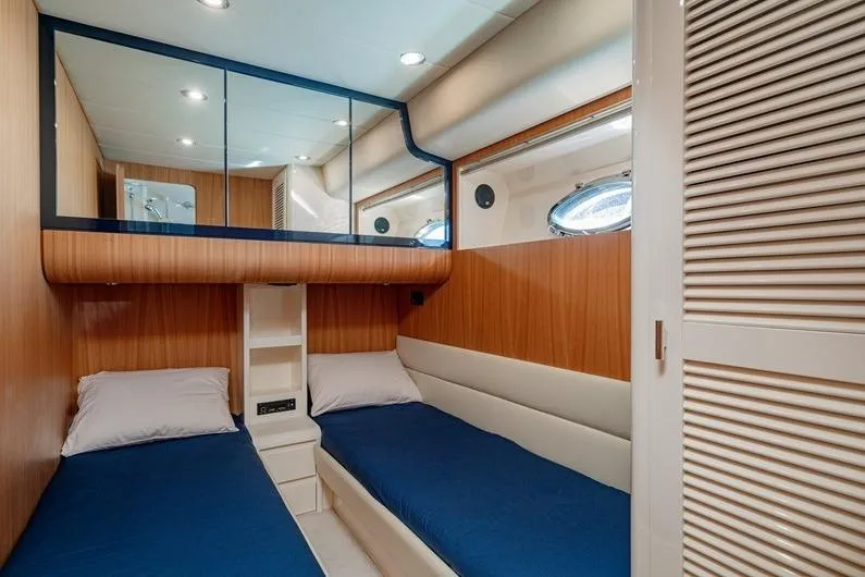  Yacht Photos Pics Luxurious cabin interior of 1996 Riva BAHAMAS 60 SPECIAL yacht with twin beds.