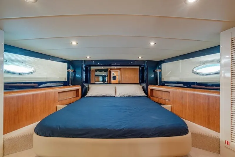  Yacht Photos Pics Luxurious cabin interior of 1996 Riva BAHAMAS 60 SPECIAL yacht with elegant wood finishes.