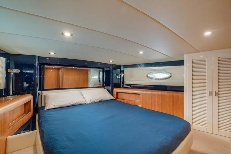  Yacht Photos Pics Luxurious cabin interior of 1996 Riva BAHAMAS 60 SPECIAL yacht with elegant wood finishes.