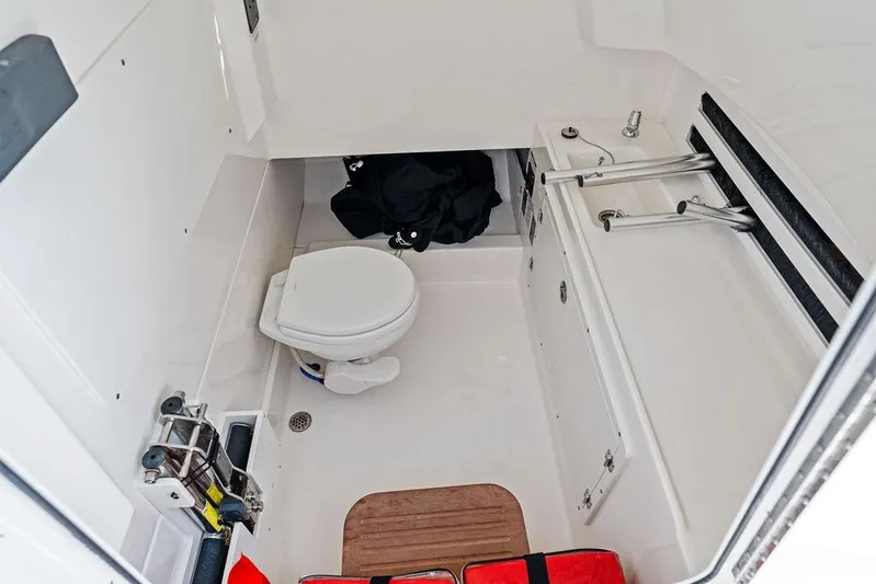  Yacht Photos Pics 2018 Boston Whaler 330 Outrage boat interior with toilet and sink.