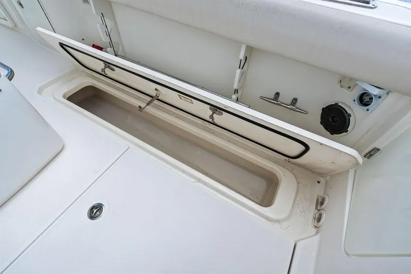  Yacht Photos Pics Open storage compartment on a 2018 Boston Whaler 330 Outrage boat deck.