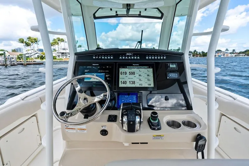  Yacht Photos Pics 2018 Boston Whaler 330 Outrage helm with advanced navigation and control systems.