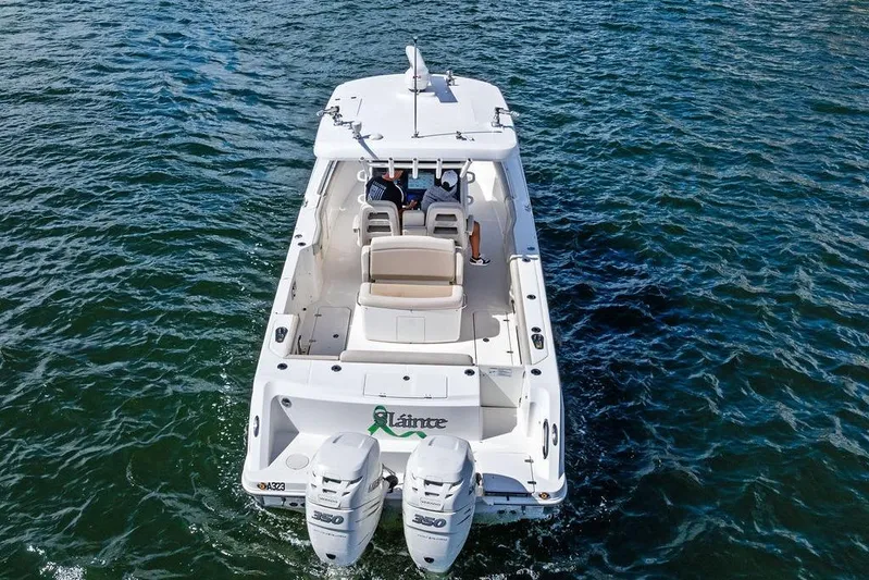  Yacht Photos Pics 2018 Boston Whaler 330 Outrage boat cruising on open water.