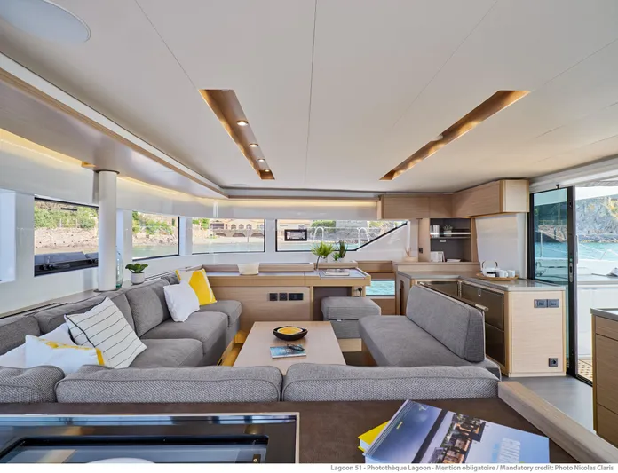  Yacht Photos Pics Luxurious interior of 2024 Lagoon LAGOON 51 yacht with modern furnishings and panoramic windows.
