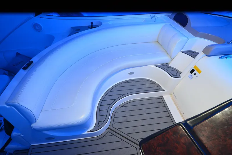 Seeking Sara Yacht Photos Pics Luxurious seating area on 2003 Cruisers Yachts 4370 Express, featuring elegant white upholstery.