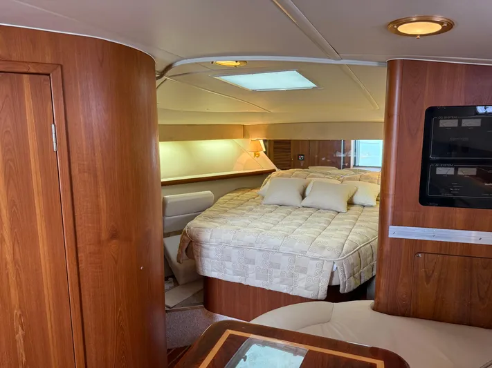 Cyette Yacht Photos Pics Luxurious cabin interior of 2003 Pursuit 3800 Express yacht with cozy bedding.