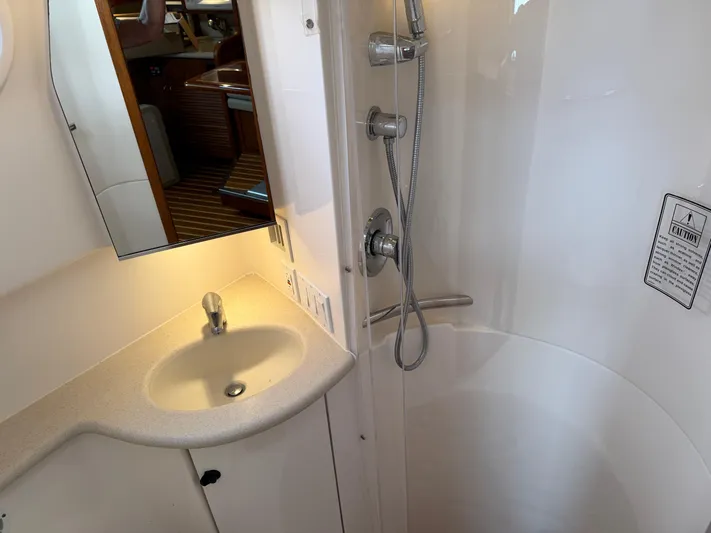 Cyette Yacht Photos Pics Bathroom interior of 2003 Pursuit 3800 Express yacht with sink and shower.