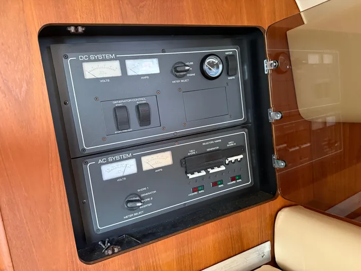 Cyette Yacht Photos Pics Electrical control panel on a 2003 Pursuit 3800 Express boat, featuring DC and AC systems.