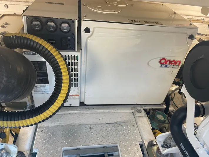 Cyette Yacht Photos Pics Engine room of 2003 Pursuit 3800 Express with Onan generator.