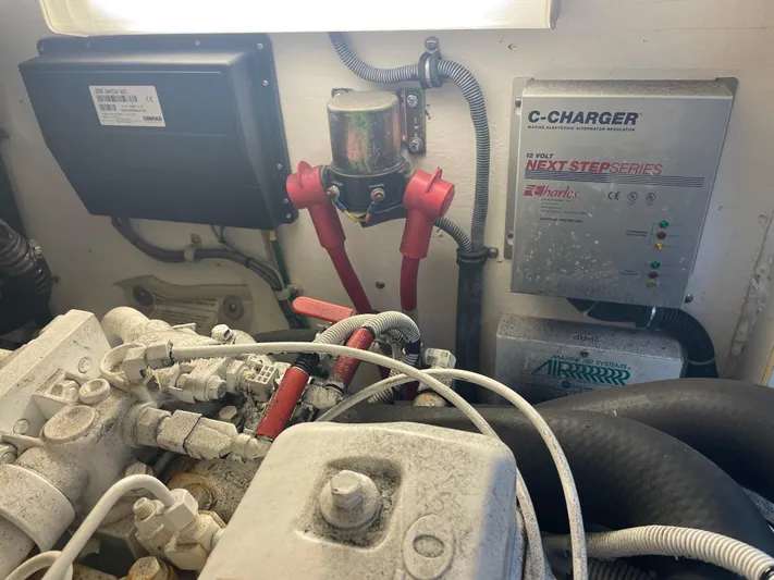 Cyette Yacht Photos Pics Engine room of a 2003 Pursuit 3800 Express with marine electronics and wiring.