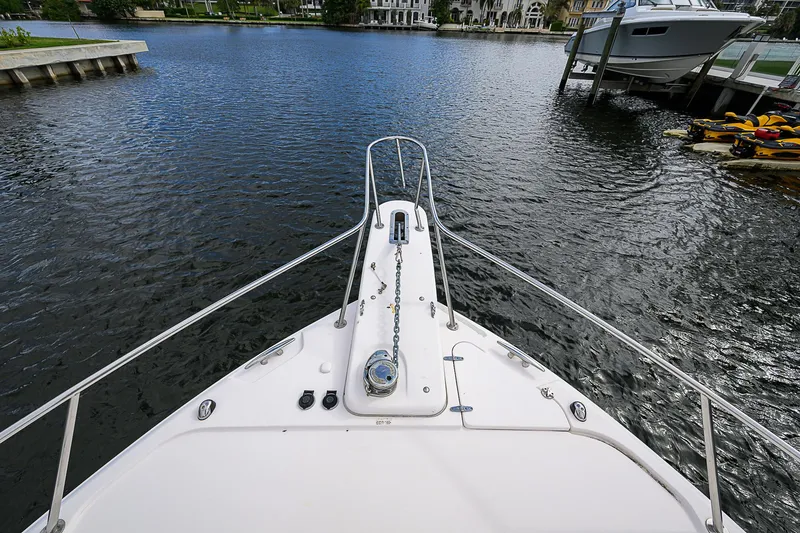  Yacht Photos Pics 2008 Grady-White Express 360 boat on calm water, docked near shoreline.