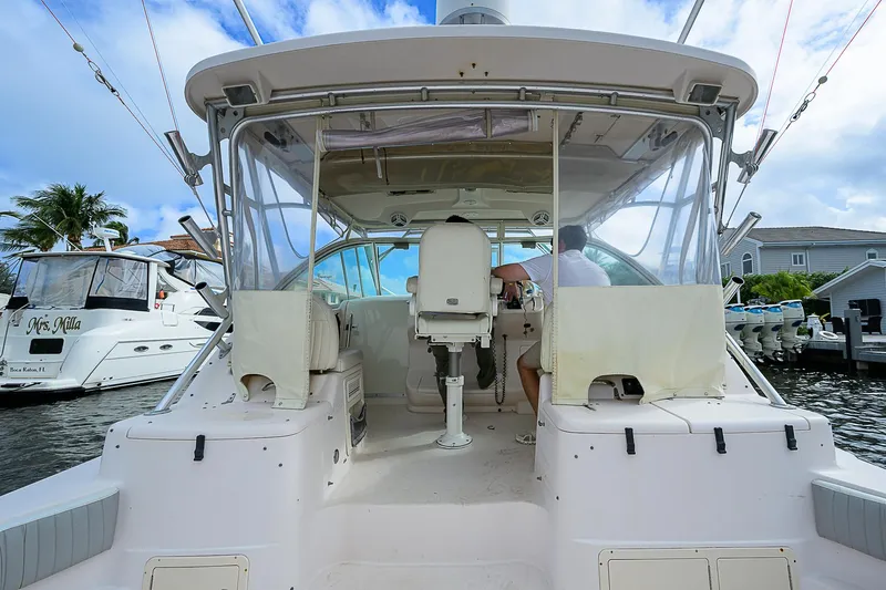  Yacht Photos Pics 2008 Grady-White Express 360 boat docked, featuring spacious cockpit and helm area.