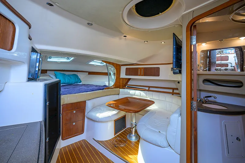  Yacht Photos Pics Luxurious 2008 Grady-White Express 360 cabin interior with seating, table, and bed.