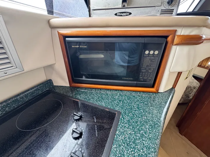  Yacht Photos Pics Microwave and stovetop in 2000 Carver 450 Voyager Pilothouse kitchen area.