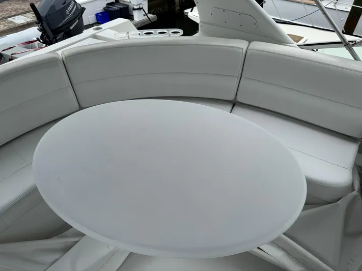  Yacht Photos Pics 2000 Carver 450 Voyager Pilothouse yacht with white seating and round table.