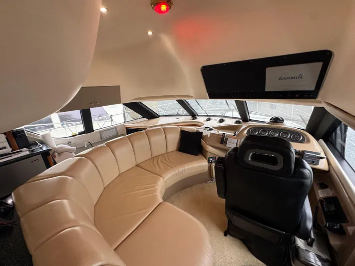  Yacht Photos Pics Luxurious interior of 2000 Carver 450 Voyager Pilothouse with leather seating and modern controls.