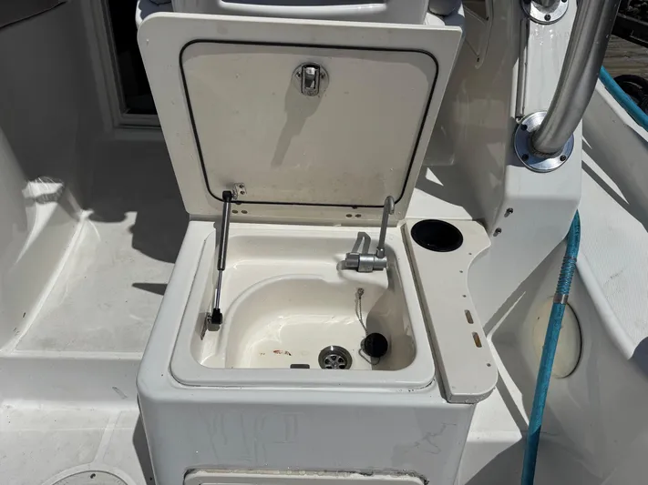  Yacht Photos Pics Open storage compartment on 2008 Boston Whaler 285 Conquest boat deck.