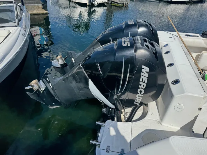 Yacht Photos Pics Twin Mercury outboard engines on a 2008 Boston Whaler 285 Conquest boat at a marina.