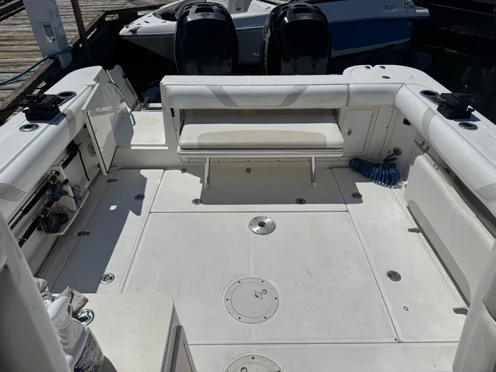  Yacht Photos Pics 2008 Boston Whaler 285 Conquest boat deck with seating and storage compartments.