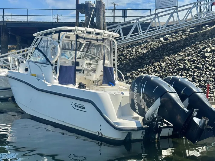  Yacht Photos Pics 2008 Boston Whaler 285 Conquest boat docked with twin Mercury engines.