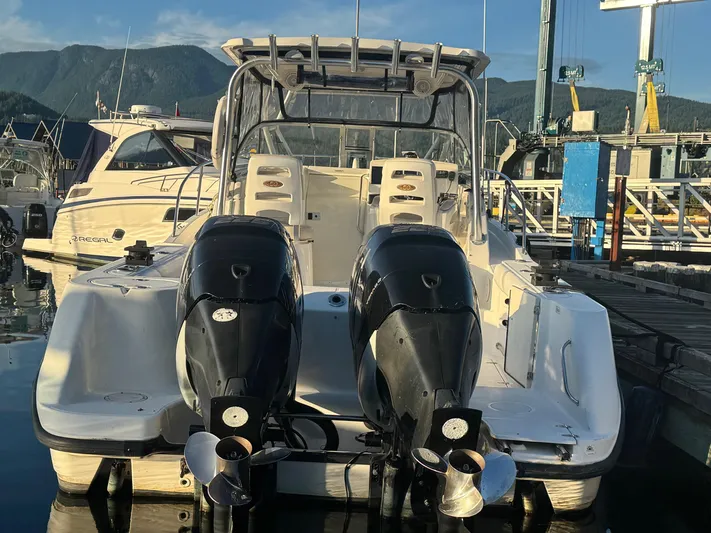  Yacht Photos Pics 2008 Boston Whaler 285 Conquest boat docked, featuring dual outboard engines.