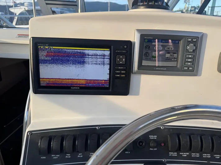  Yacht Photos Pics 2008 Boston Whaler 285 Conquest dashboard with Garmin and SmartCraft displays.