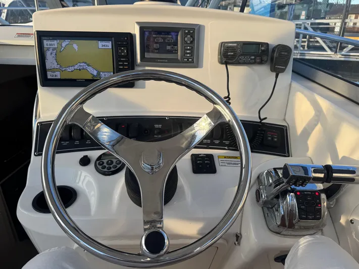  Yacht Photos Pics 2008 Boston Whaler 285 Conquest helm with navigation screens and controls.