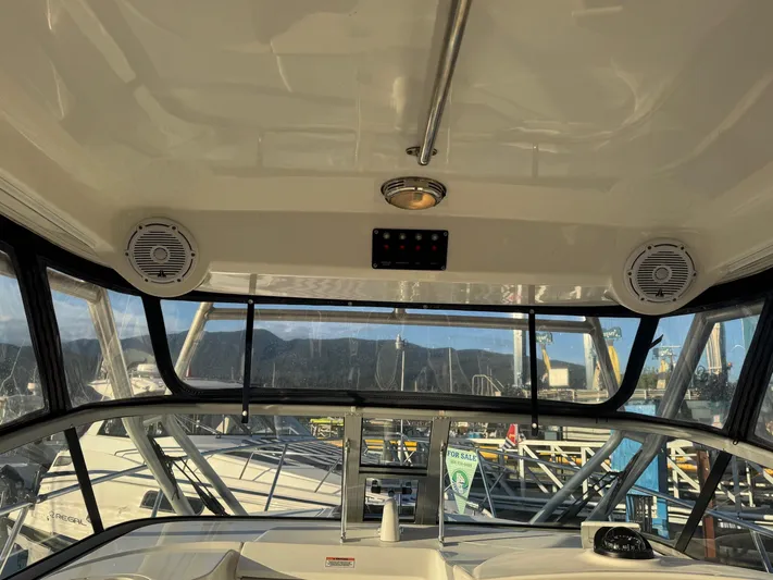  Yacht Photos Pics Interior view of 2008 Boston Whaler 285 Conquest boat with speakers and windows.