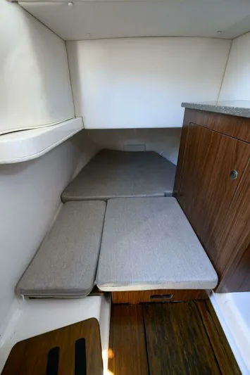 Joker's Jewel Yacht Photos Pics Interior of 2019 Wellcraft 352 Fisherman with cushions and wood paneling.