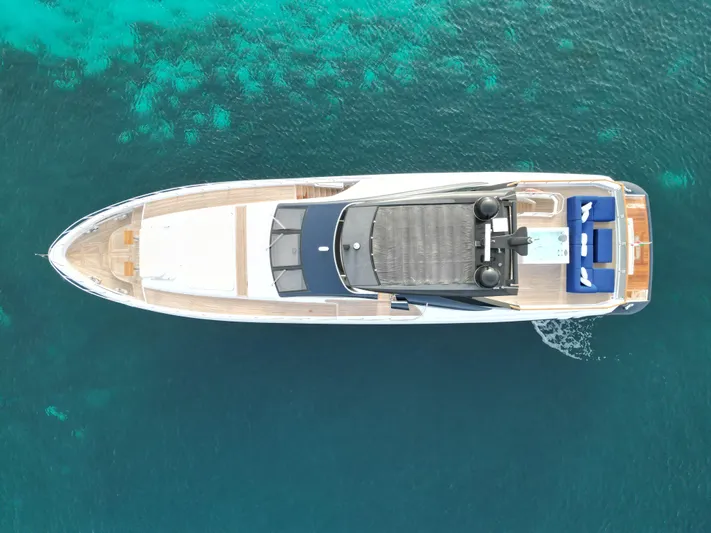 Altvs Yacht Photos Pics Aerial view of 2020 PerMare Amer F100 yacht on clear blue water.