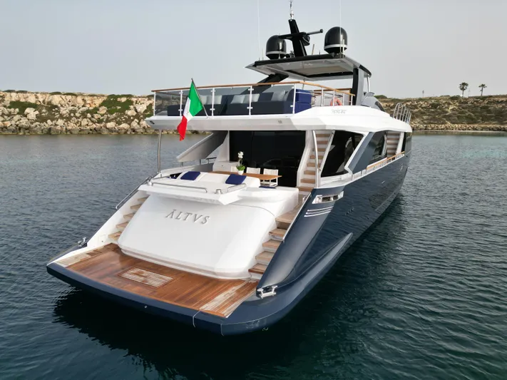 Altvs Yacht Photos Pics Luxurious 2020 PerMare Amer F100 yacht on serene water, featuring elegant design and Italian flag.