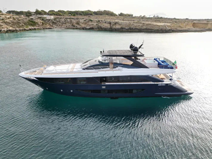 Altvs Yacht Photos Pics Luxurious 2020 PerMare Amer F100 yacht cruising in serene coastal waters.