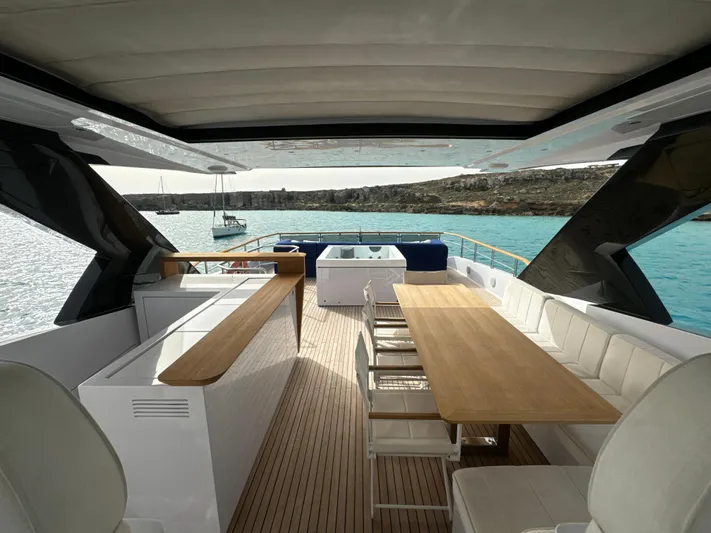 Altvs Yacht Photos Pics Luxurious 2020 PerMare Amer F100 yacht interior with elegant dining area and scenic ocean view.