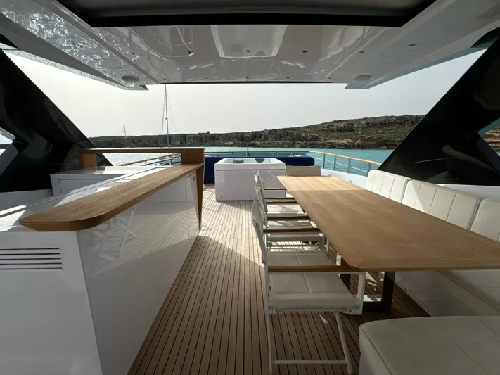 Altvs Yacht Photos Pics Luxurious 2020 PerMare Amer F100 yacht deck with elegant seating and dining area.