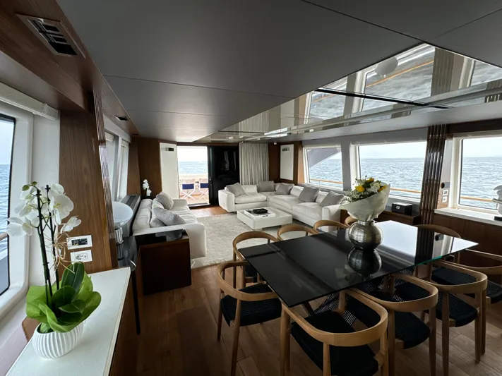 Altvs Yacht Photos Pics Luxurious interior of 2020 PerMare Amer F100 yacht with elegant dining and seating areas.