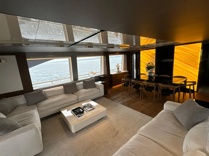 Altvs Yacht Photos Pics Luxurious interior of 2020 PerMare Amer F100 yacht with elegant seating and dining area.