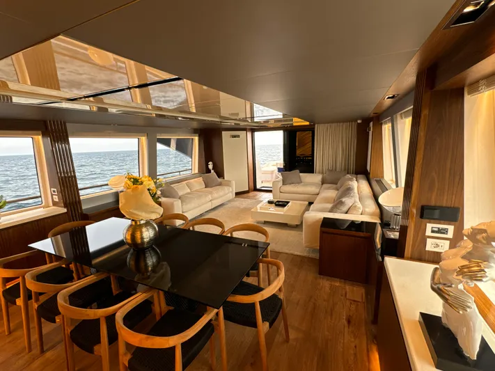 Altvs Yacht Photos Pics Luxurious interior of 2020 PerMare Amer F100 yacht with elegant seating and dining area.