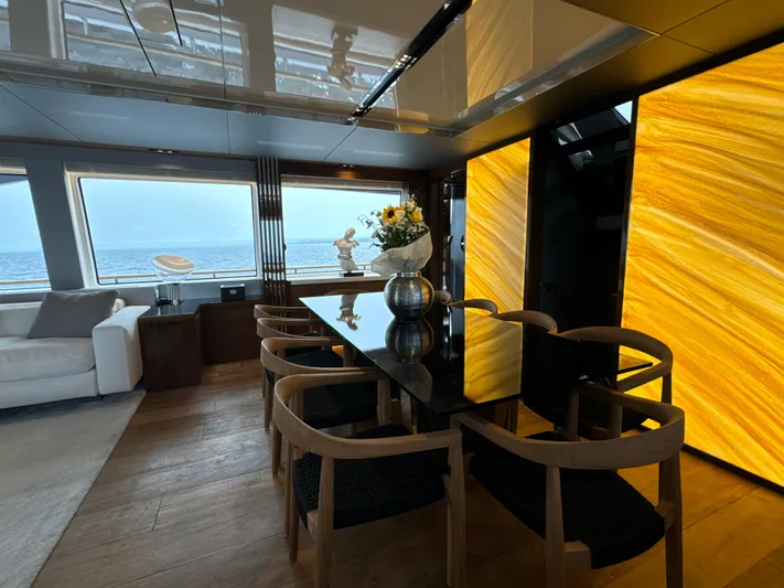 Altvs Yacht Photos Pics Luxurious interior of 2020 PerMare Amer F100 yacht with elegant dining area and ocean view.