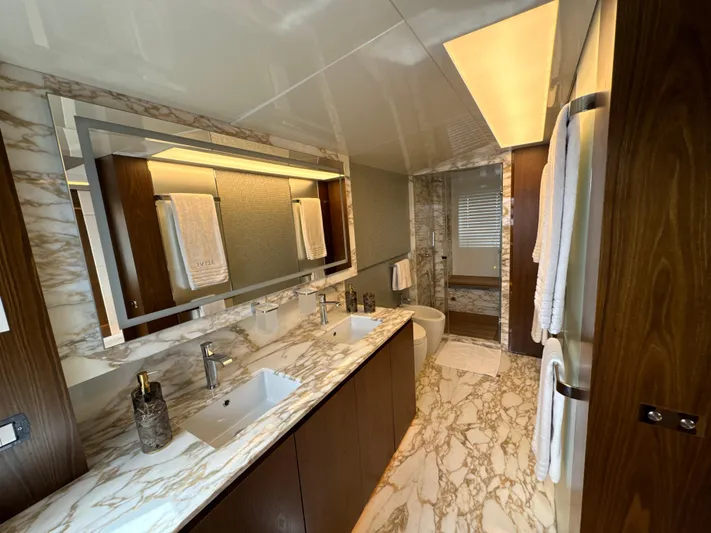 Altvs Yacht Photos Pics Luxurious bathroom in 2020 PerMare Amer F100 yacht with marble countertops and modern fixtures.