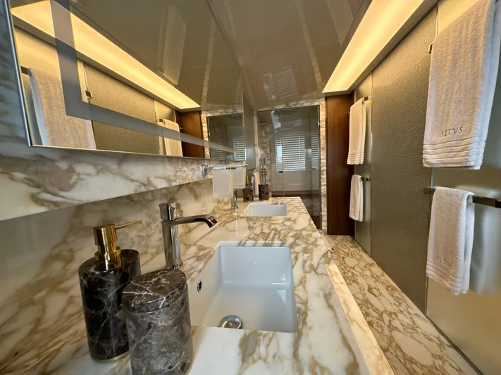 Altvs Yacht Photos Pics Luxurious marble bathroom in 2020 PerMare Amer F100 yacht, featuring elegant fixtures and ambient lighting.