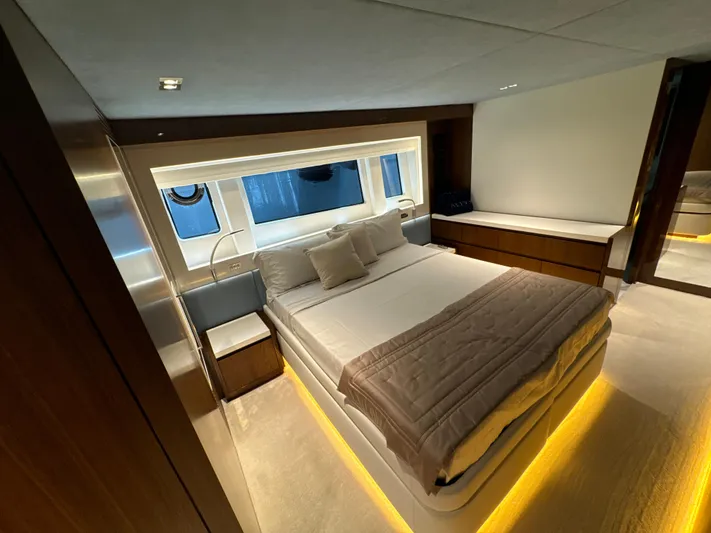 Altvs Yacht Photos Pics Luxurious bedroom interior of 2020 PerMare Amer F100 yacht with modern design and ambient lighting.