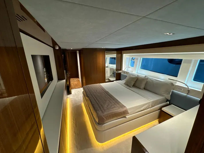 Altvs Yacht Photos Pics Luxurious bedroom interior of 2020 PerMare Amer F100 yacht with modern design and ambient lighting.