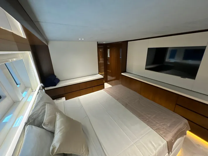 Altvs Yacht Photos Pics Luxurious bedroom interior of 2020 PerMare Amer F100 yacht with modern design and large TV.